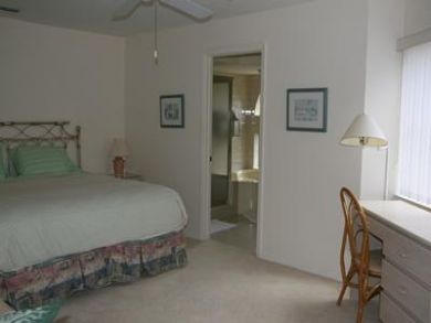 Master bedroom with desk & ensuite bathroom